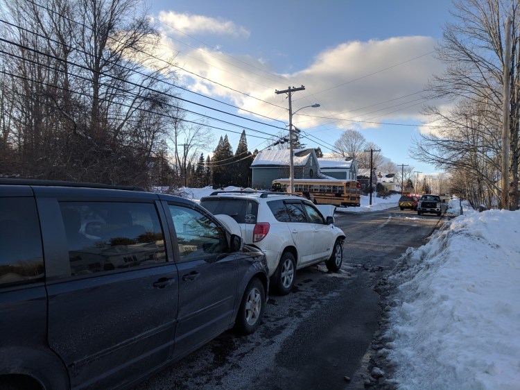 Witnesses said the white Toyota SUV slammed into the back of the school bus on West Auburn Road in Auburn Thursday afternoon.