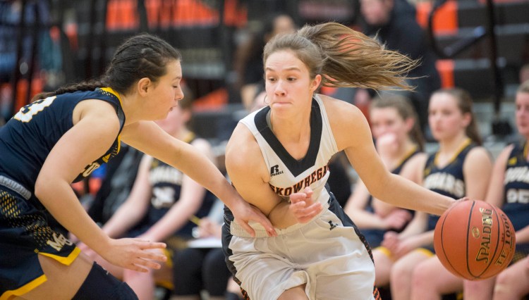 Skowhegan freshman Jaycie Christopher, right, drives by Mt. Blue defender Sierra Fay during a Jan. 15 game in Skowhegan.