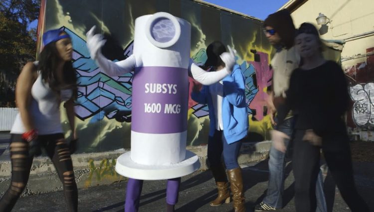 This still image from a 2015 video presented as evidence by the U.S. Attorney's Office in federal court in Boston on Wednesday, Feb. 13, 2019, shows a scene from a rap video made to motivate Insys Therapeutics sales representatives to get doctors to prescribe higher doses of the company's highly addictive fentanyl spray. 