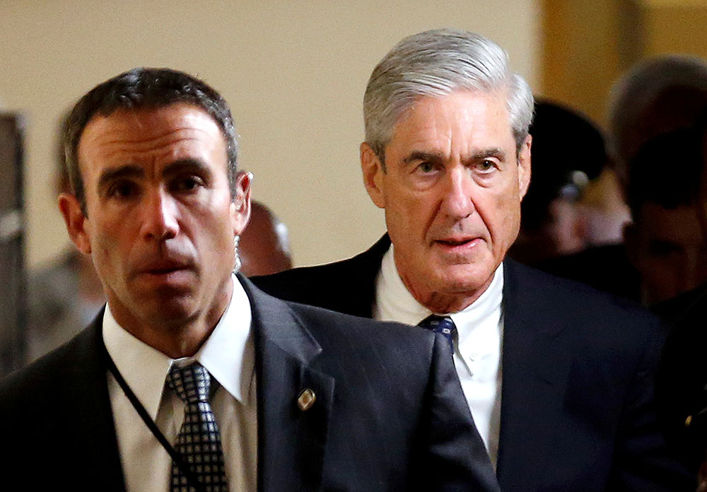 Special Counsel Robert Mueller (R) departs after briefing members of the U.S. Senate on his investigation into potential collusion between Russia and the Trump campaign on Capitol Hill in Washington, U.S., June 21, 2017.   REUTERS/Joshua Roberts - RC11C635F380