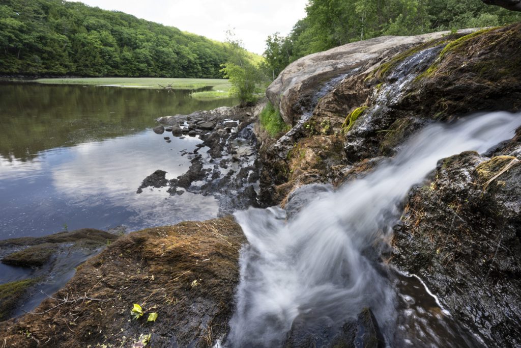 Water cascades over rocks where the Cathance River meets Merrymeeting Bay at the Head of Tide Park in Topsham. It took 12 years to carve The town's first waterfront park. Now the whole park is owned by Topsham, with a conservation easement held by the Brunswick-Topsham Land Trust.