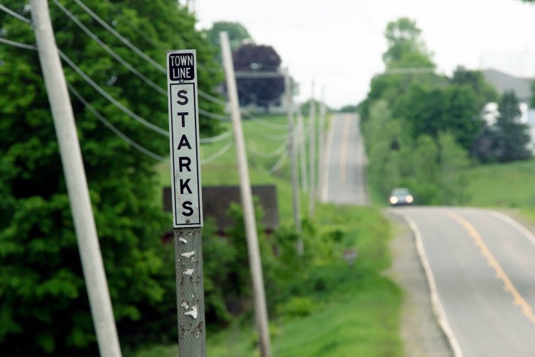 A sign marks the line between the small towns Starks and Anson in Somerset County. 