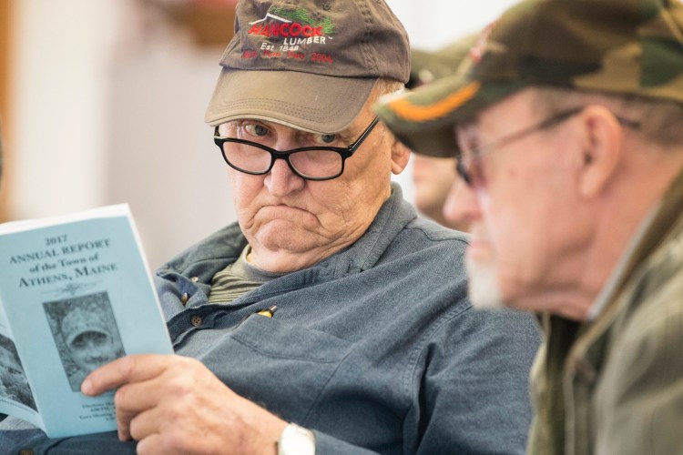 Earlande Lake, left, looks at Erald Corson, as he asks a question March 9, 2018, at last year's Athens Town Meeting at Somerset Academy. The 2019 edition of Town Meeting is set for Saturday, March 9, again, with elections on Friday.