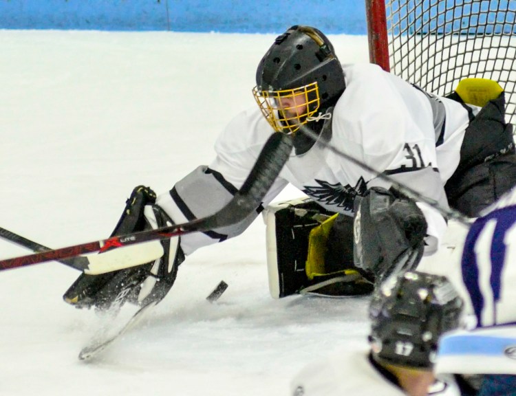 Kennebec goalie Ben Grenier makes a save against Presque Isle during the Class B North semifinals Saturday at Colby College in Waterville. 