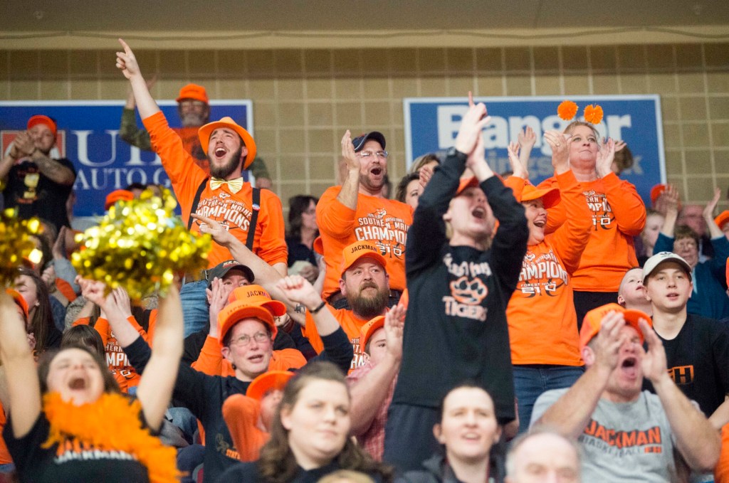 Forest Hills fans decked out in orange school colors fill the stands for the class D state championship game Saturday at the Cross Insurance Center in Bangor.