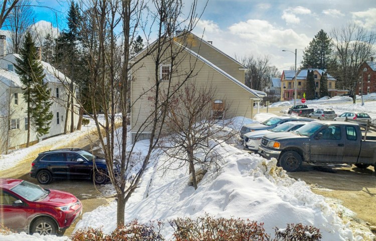 The parking lots between 103 Winthrop St., center, as seen from the window of Cribstone Capital Management located around the corner on North Chestnut Street on March 7 in Augusta.