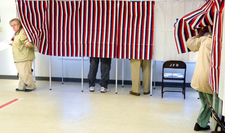 Voters cast their votes on 32 warrant articles at Tuesday's secret-ballot Town Meeting in the Jefferson fire and rescue station.