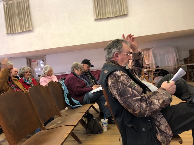 Former 21-year Cornville Selectman Carroll Gould votes on an article Saturday at Town Meeting, held at the Town Hall.