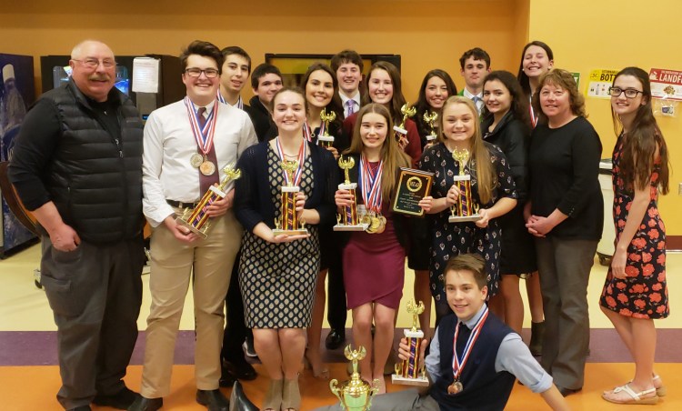 Monmouth Academy Academic Decathlon members front from left are Coach Scott Foyt, Hayden Luce, Delaney Houston, Rhayna Poulin, Alicen Burnham, Ed Zuis, Coach Cathy Foyt and Cammie Houston.
Back from left are Evan Hasenfus, Joe Crocker, Amber Currie, Michael Dolan, Natalie Grandahl, Kaitlin Hunt, Nick Fournier, Hannah Levesque and Jess Clavet.