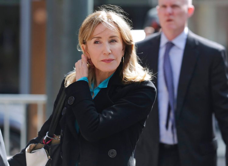 Actress Felicity Huffman arrives at federal court in Boston on Wednesday, April 3, 2019, to face charges in a nationwide college admissions bribery scandal. 