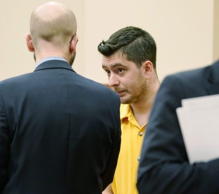 Joseph Lewis stands with his attorney, Stephen Shea, during his initial court appearance Oct. 24 in Portland.