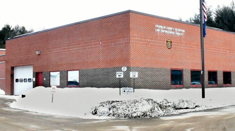 A cruiser exits the Franklin County Jail in Farmington beside the sheriff's office on Dec. 18, 2018. County commissioners have agreed to sign a letter from Sheriff Scott Nichols to Gov. Janet Mills about the jail's funding problems, which he said is driven by state funding caps.