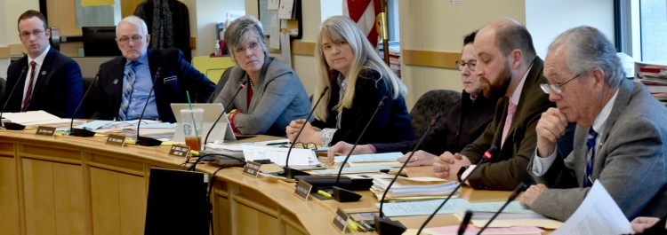 Sen. Rebecca Millett, center, calls for a vote from members of the Committee on Education and Cultural Affairs on a bill to ban the use of Native American mascots in public schools during a hearing in Augusta on Monday. The committee voted 7-5 along party lines that the bill ought to pass. It is now headed for the House of Representatives.