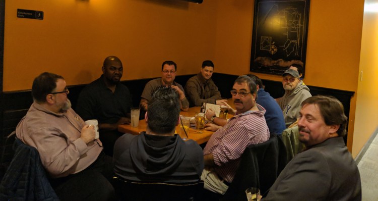 Four members of the Waterville City Council gathered with Mayor Nick Isgro and others at Portland Pie Company after the council meeting on Tuesday. From left are Councilors Michael Morris, Phil Bofia, Jay Coelho with his back to the camera, and Sidney Mayhew. Mayor Nick Isgro is in the far corner. Waterville resident Rien Finch has requested the city to investigate the legality of the gathering. When three or more city councilors gather, it may, under circumstances defined in the Maine Freedom of Access Law, constitute an illegal meeting.