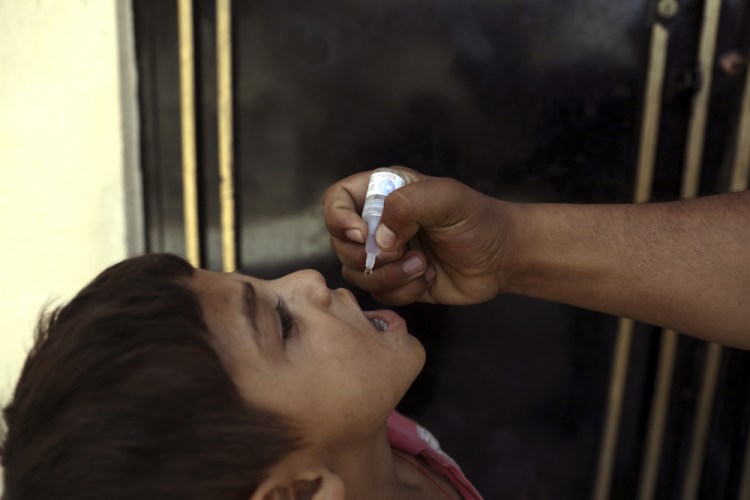 A health worker administers a vaccination to a child during a polio campaign in Kabul, Afghanistan, on June 15. The The estimated target population for the new vaccination initiative is the country's 10 million children under 5.