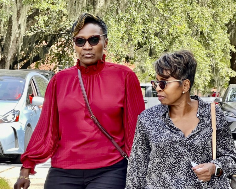 Ahmaud Arbery's mother Wanda Cooper-Jones walks towards the Glynn County Courthouse in Brunswick, Ga on Monday, Oct. 18. 