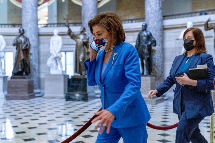 House Speaker Nancy Pelosi of California walks toward the House Chamber to convene the House for legislative business at the Capitol in Washington on Tuesday. “The fact is, that if there are fewer dollars to spend there are choices to be made,” Pelosi said as Democrats try to reach agreement on President Biden's social safety net bill.