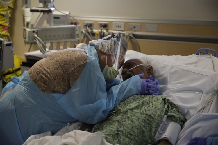 Romelia Navarro, 64, weeps while hugging her husband, Antonio, in his final moments in a COVID-19 unit at St. Jude Medical Center in Fullerton, Calif., in July 2020.

