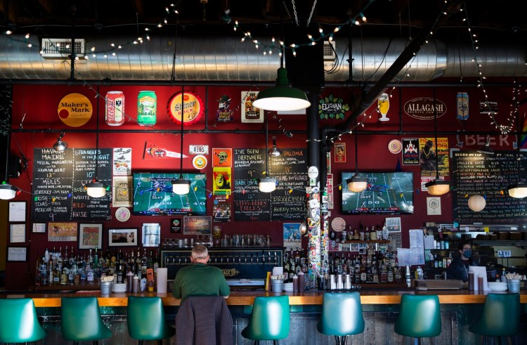 PORTLAND, ME - NOVEMBER 7:  Craig Bodo of Raleigh, NC watches the Patriots football game at Salvage BBQ in Portland. (Photo by Derek Davis/Staff Photographer)