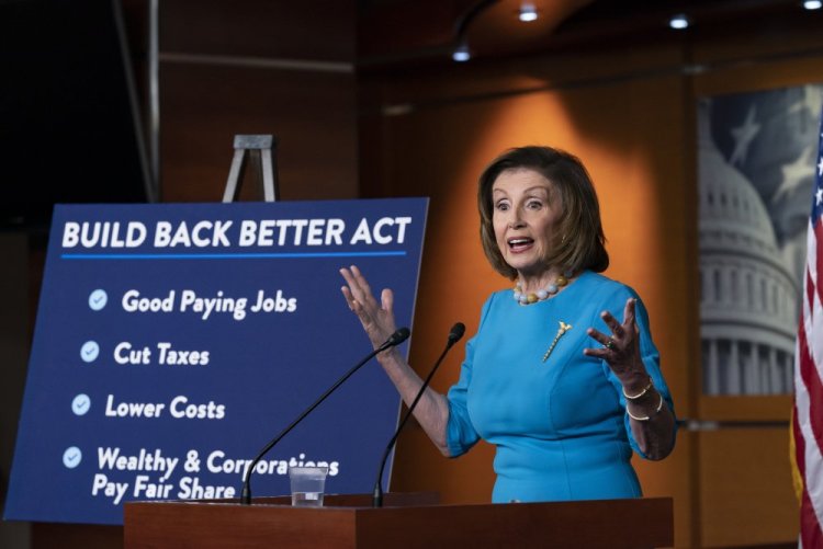 Speaker of the House Nancy Pelosi, D-Calif., talks to reporters about plans to pass President Biden's domestic agenda as the House meets to debate the Build Back Better Act, at the Capitol on Thursday. 