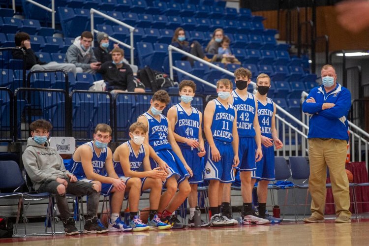 Members of the Erskine Academy boys basketball team watch from the bench during a Dec. 7 preseason game against Hall-Dale at the Augusta Civic Center.