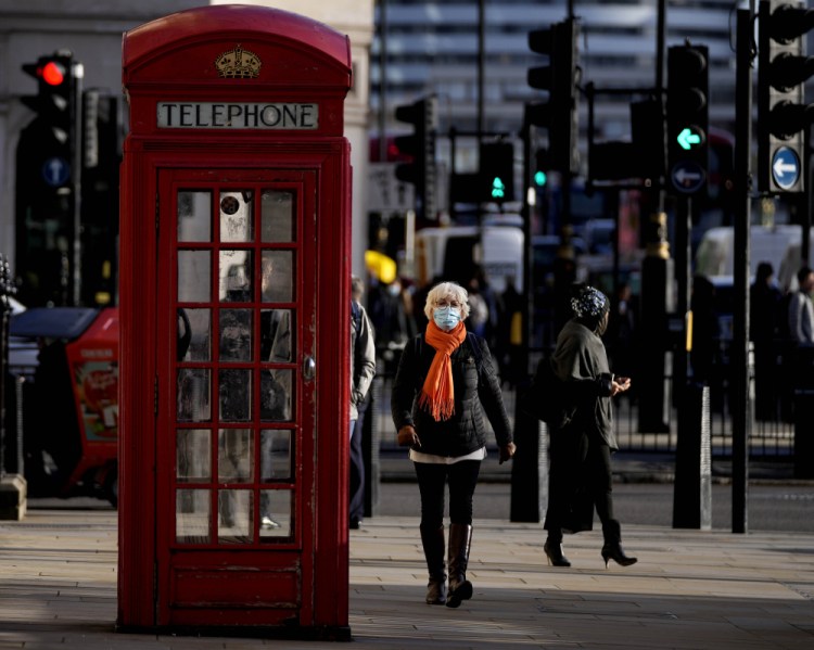 People walk through Westminster in London on Thursday.
