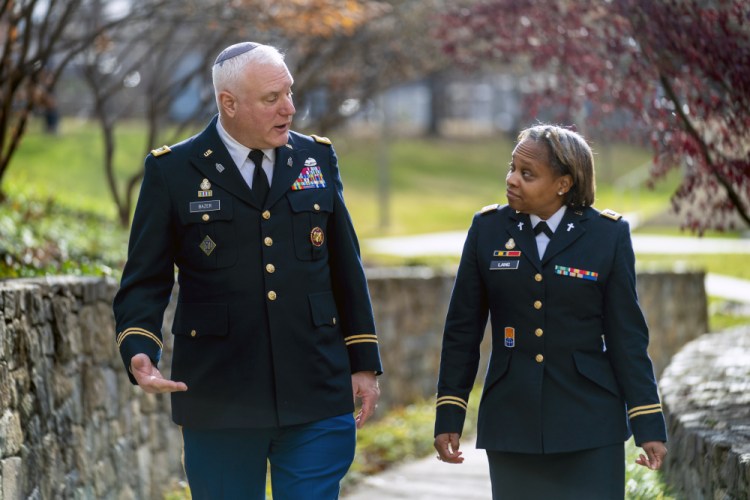 Head National Guard chaplain Col. Larry Bazer, deputy director of the chaplain office, and Chaplain Maj. A'Shellarien Lang at the National Guard Bureau in Arlington, Va., on Friday. 

