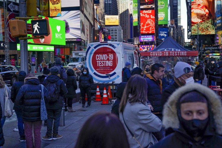 People wait in a long line to get tested for COVID-19 in Times Square, New York, on Monday. Just a couple of weeks ago, New York City seemed like a relative bright spot in the U.S. coronavirus struggle. Now it's a hot spot, confronting a dizzying spike in cases, a scramble for testing, a quandary over a major event and an exhausting sense of déjà vu. 

