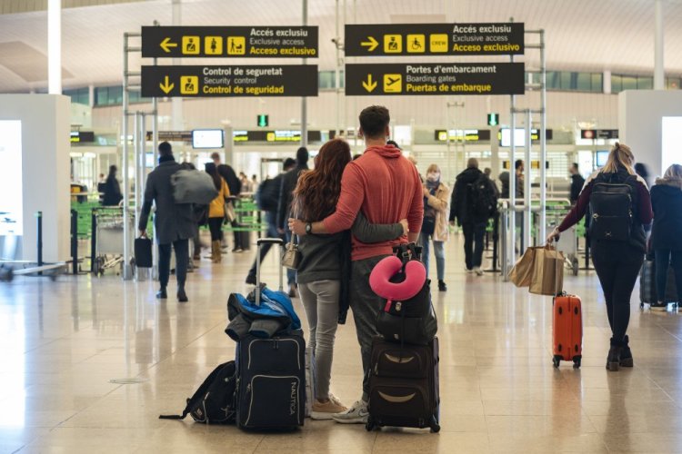 A couple stand outside the security area at  Barcelona Airport in Spain on Wednesday. 

