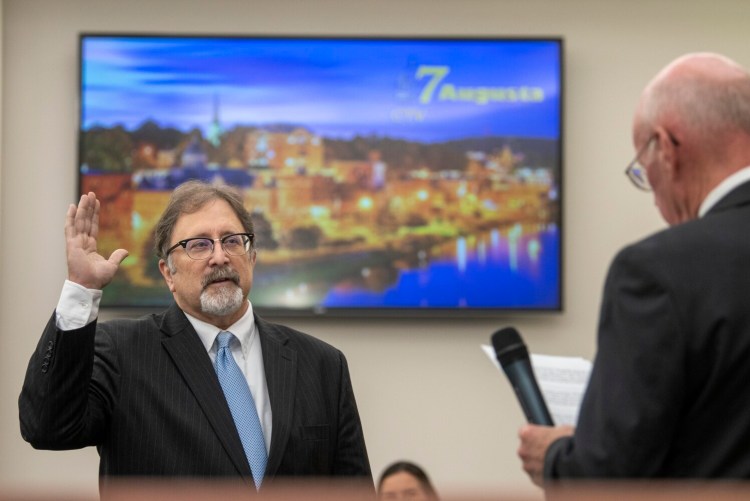 Mayor-elect Mark O'Brien, left, takes the oath of office from Daniel Wathen during inauguration ceremony Thursday at Augusta City Center. 