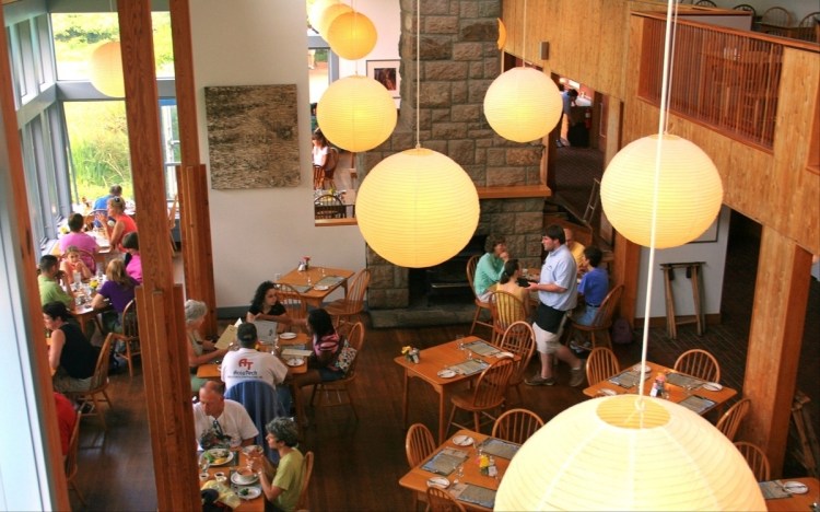 In this undated photo provided by the National Park Service, customers sit in the main dining room of the Jordan Pond House in Acadia National Park in Maine. Acadia National Park wants to tear down the famous Jordan Pond House restaurant, at a scenic spot where tea and popovers have been served since the late 1800s, and replace it for as much as $20 million because of structural problems, reported Monday, Feb. 7, 2022, by The Bangor Daily News. 