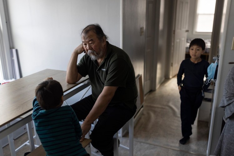 Pavel Sulyandziga with his sons Cade, 4, left, and Andrey, 6, at their home in Yarmouth. Sulyandziga is a Russian activist and member of the Udege peoples of Eastern Russia, who has worked most prominently in advocating for indigenous groups. He and his family sought political asylum in the United States several years ago.