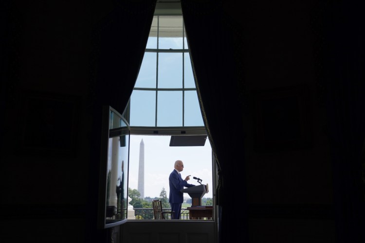President Biden speaks Friday at the White House. Over five decades in Washington, Biden knew that the way to influence was to be in the room where it happens. But in the second year of his presidency, some of Biden’s most striking, legacy-defining legislative victories came about by staying out of it.